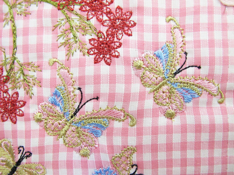 Earth Dance Machine Embroidery Designs. Butterfly, love hears, floral and flower gingham wall hanging. Pretty machine embroidery design.