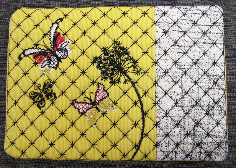 Earth Dance Machine Embroidery Designs. Butterfly, love hears, floral and flower mug rug. Pretty machine embroidery design. Great use of decorative stitches.