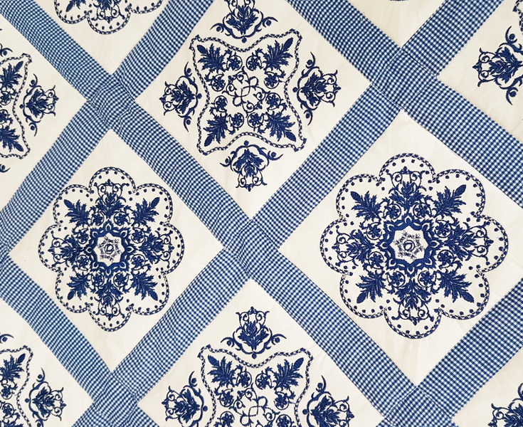 Panache Machine Embroidery Designs by Stitchingart. Patchwork floral blue and white quilt.