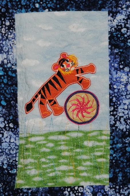 Hey Day Circus, machine embroidery designs, circus tent, flags, clown, juggling, balloons, elephant, giraffe, lion, hoop, daschund, dogs, seal, sleep my darling, teddy, unicycle, tiger wall hanging, blanket, children, fun