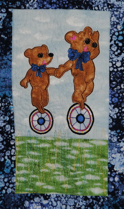 Hey Day Circus, machine embroidery designs, circus tent, flags, clown, juggling, balloons, elephant, giraffe, lion, hoop, daschund, dogs, seal, sleep my darling, teddy, unicycle, tiger wall hanging, blanket, children, fun