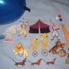 Hey Day Circus, machine embroidery designs, circus tent, flags, clown, juggling, balloons, elephant, giraffe, lion, hoop, daschund, dogs, seal, sleep my darling, teddy, unicycle, tiger wall hanging, blanket, children, fun