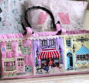 Sac de Ville, Machine Embroidery Designs, Poodle, dog, fashion, lady, woman, dressed to impress, table chair, floral, flowers, plant, lettuce, fruit shop, vegetable shop, shop, bin, mouse, trash bin, door, window, ladder, lamp, cafe, topiary, plant, shop, Paris, shutters, street lamp, awning, flowers, bouquet, tap, door, bird, pigeon, cakes, bakery, street lamp, blue bird, streets of Paris, city, Paris, shovel, fence, quilt, patchwork, tulips, open sign, handbag, bag, fabric shop, fabric sale, bag, handbag, cute, sophisticated, beautiful