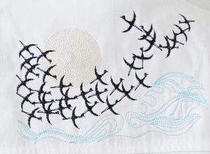 Whisper of Wings, machine embroidery designs, birds, swallows, moon, sun, clouds, wings, wind, bird migration, water, waves, clothing, jacket, pullover, jumper. fashion, place mat, homewares, home decor, beautiful, nature